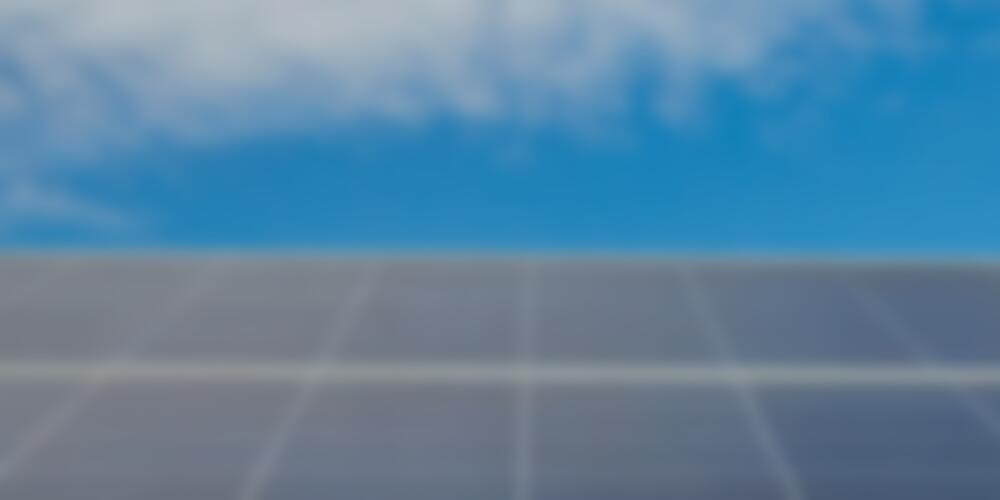 Solar panel underneath a blue sky