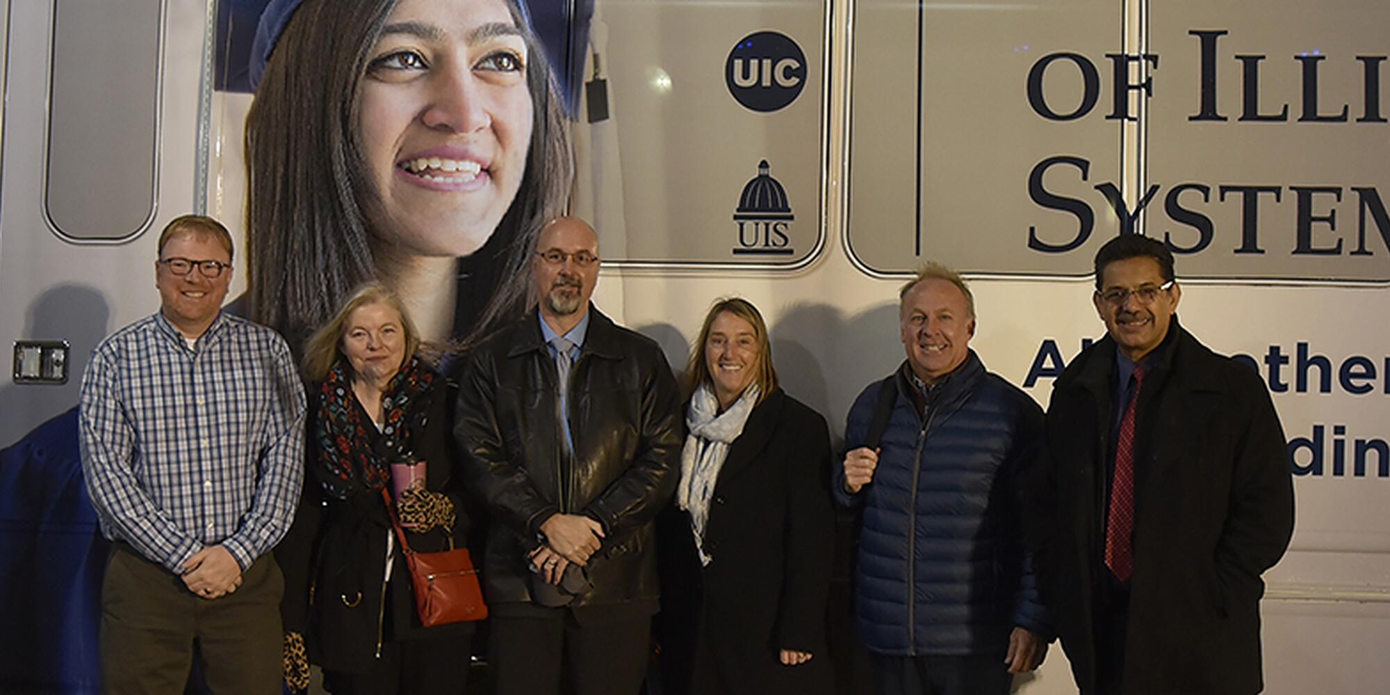 Facilities and Services Leaders in front of the UI-Ride bus